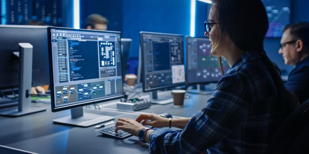 Business hand clicking "Hire" on a laptop screen displaying profiles of senior DevOps Engineers next to a 48-hour countdown clock