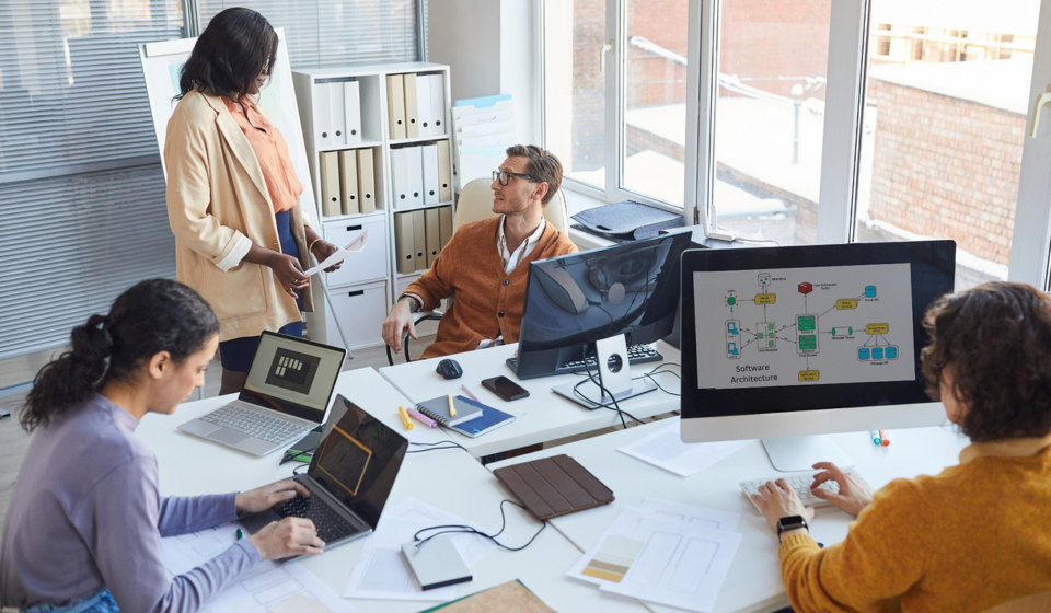 A professional team of enterprise Java backend developers collaborating on scalable server-side architecture.
