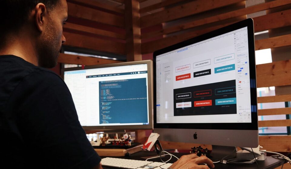 A fast-moving digital illustration showing a flexible plug-and-play connector linking a US map pin to a developer workspace with floating code snippets. The text reads "On-Demand Backend Developers for US Companies."