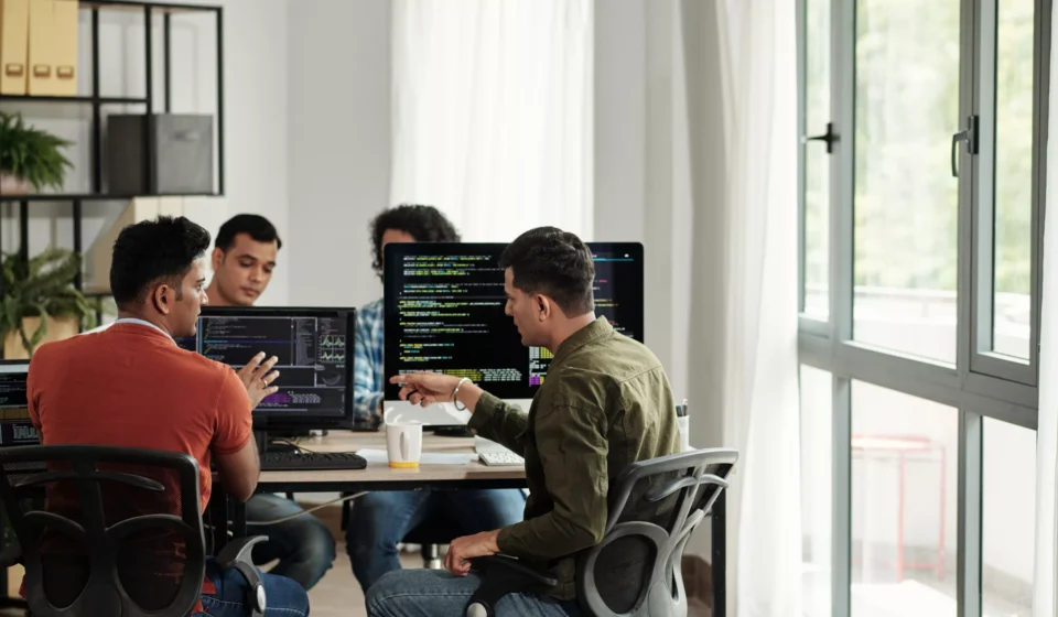 Software engineering team collaborating on backend architecture with servers, databases, and API workflows, highlighting the value of Backend Talent
