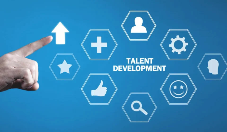 HR recruiter and hiring manager reviewing code portfolios and technical assessment scores to evaluate Technical Talent effectively