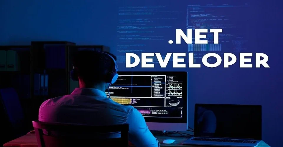 Enterprise HR team and technical leads interviewing a .NET developer with code on screen, showcasing the process to Hire .NET Developers for scalable applications