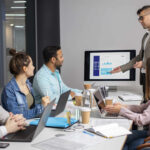 HR professionals and engineering managers collaborating with recruitment partners to scale tech teams in a modern office environment
