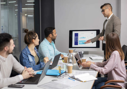 HR professionals and engineering managers collaborating with recruitment partners to scale tech teams in a modern office environment