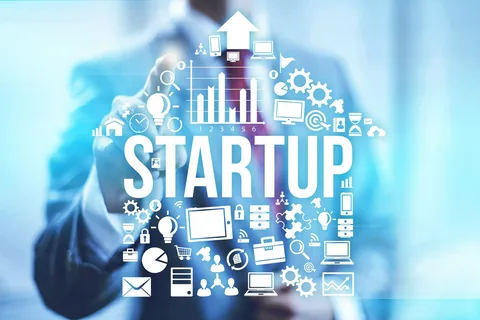 A vibrant illustration featuring a startup rocket ship navigating through a complex maze of talent pools, with a guiding hand representing specialized Tech Recruiters lighting the way. The scene includes icons for niche technologies like AI, blockchain, and cloud computing, with a network of connected nodes symbolizing targeted candidate sourcing. Overlaid text reads "Why Startups Should Partner with Niche Tech Recruiters." The image conveys how expert Tech Recruiters help startups bypass generic hiring bottlenecks and access specialized talent.