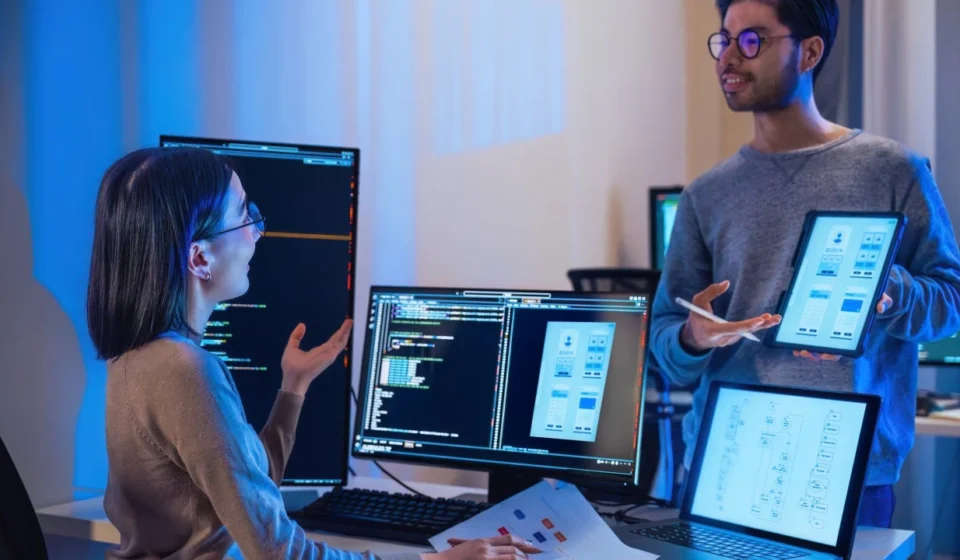 Engineering hiring manager reviewing Infrastructure as Code scripts and Terraform templates on screen while interviewing a DevOps candidate