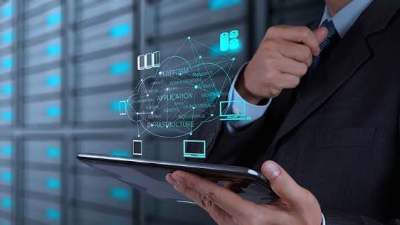 Recruiter and engineering lead reviewing resumes and container architecture diagrams to hire engineers for Containerized Applications