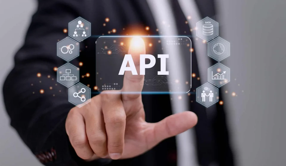 API developer designing RESTful endpoints and microservices on a multi-monitor setup, showcasing what defines a Great API Developer
