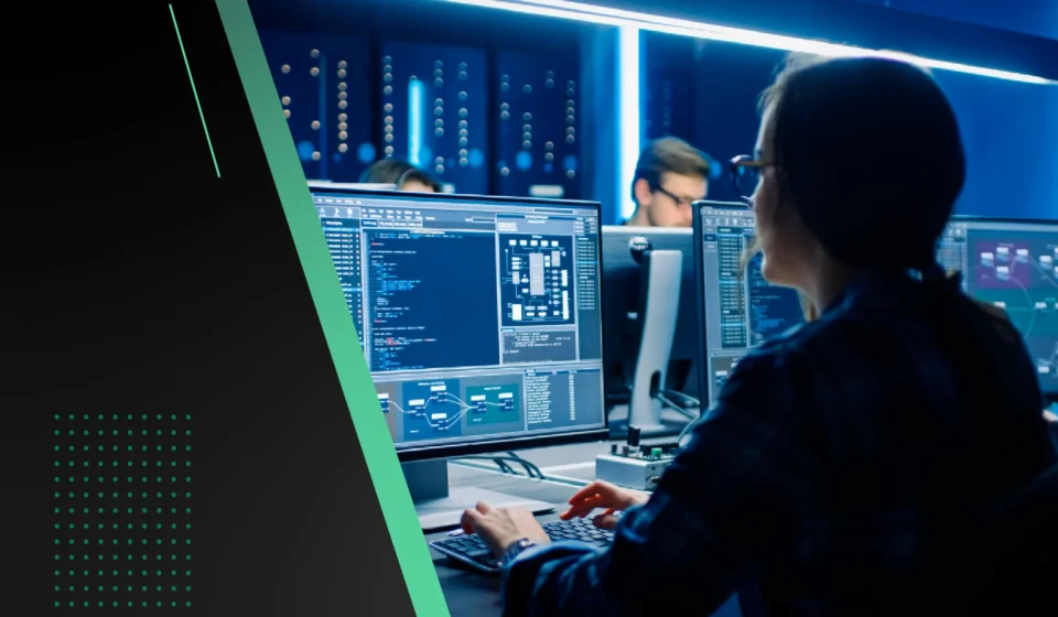 Site Reliability Engineer monitoring system dashboards and incident alerts in a command center, showcasing the role of a Site Reliability Engineer