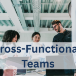 A vibrant illustration of a circular team formation where diverse specialists—frontend developers, backend engineers, DevOps professionals, data scientists, QA testers, and product designers—are connected by glowing lines representing collaboration and shared goals. Each figure holds a distinct tool icon, while a central hub displays a unified project dashboard. Overlaid text reads "Building Cross-Functional Engineering Teams With Specialized Talent." The image represents the power of Cross-Functional Engineering teams that combine diverse expertise to deliver end-to-end solutions.