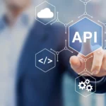 An illustration of interconnected API endpoints linking developers, microservices, and cloud platforms. A recruiter evaluates candidate profiles against an API-first architecture blueprint. Overlaid text reads "Recruiting Developers for API-First Technology Companies." The image represents the need for engineers who thrive in API-driven environments.